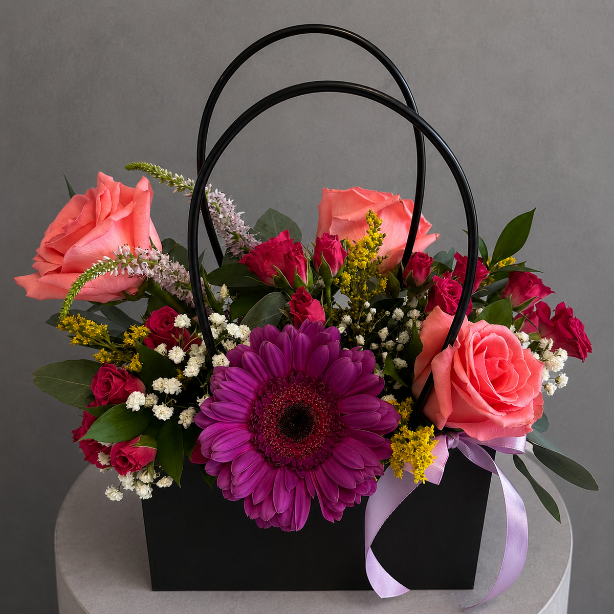 Black Flower Bag Coral Rose and Gerbera Arrangement